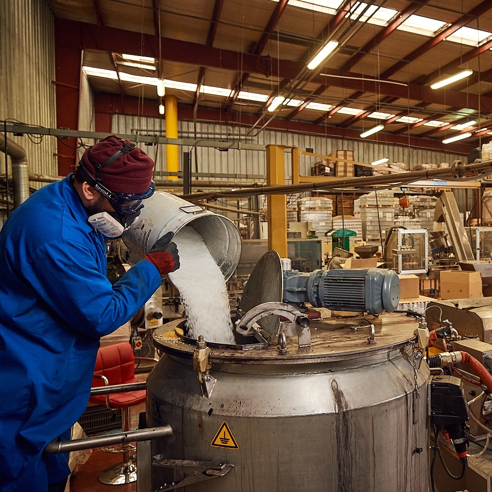 Man using Crink JLF Pro gloves in a factory